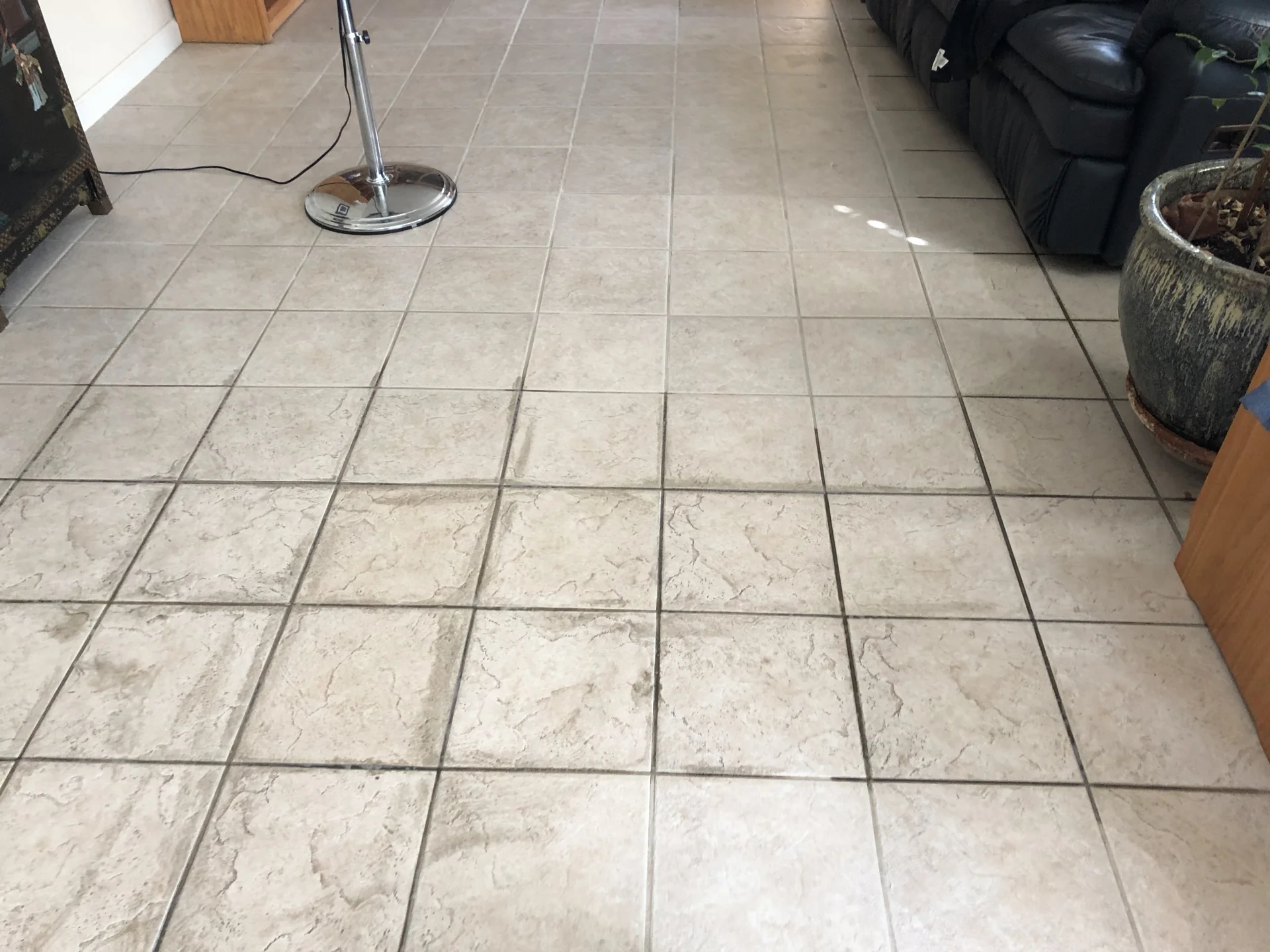 Tile floor with visible cleaning contrast from another Grasso job
