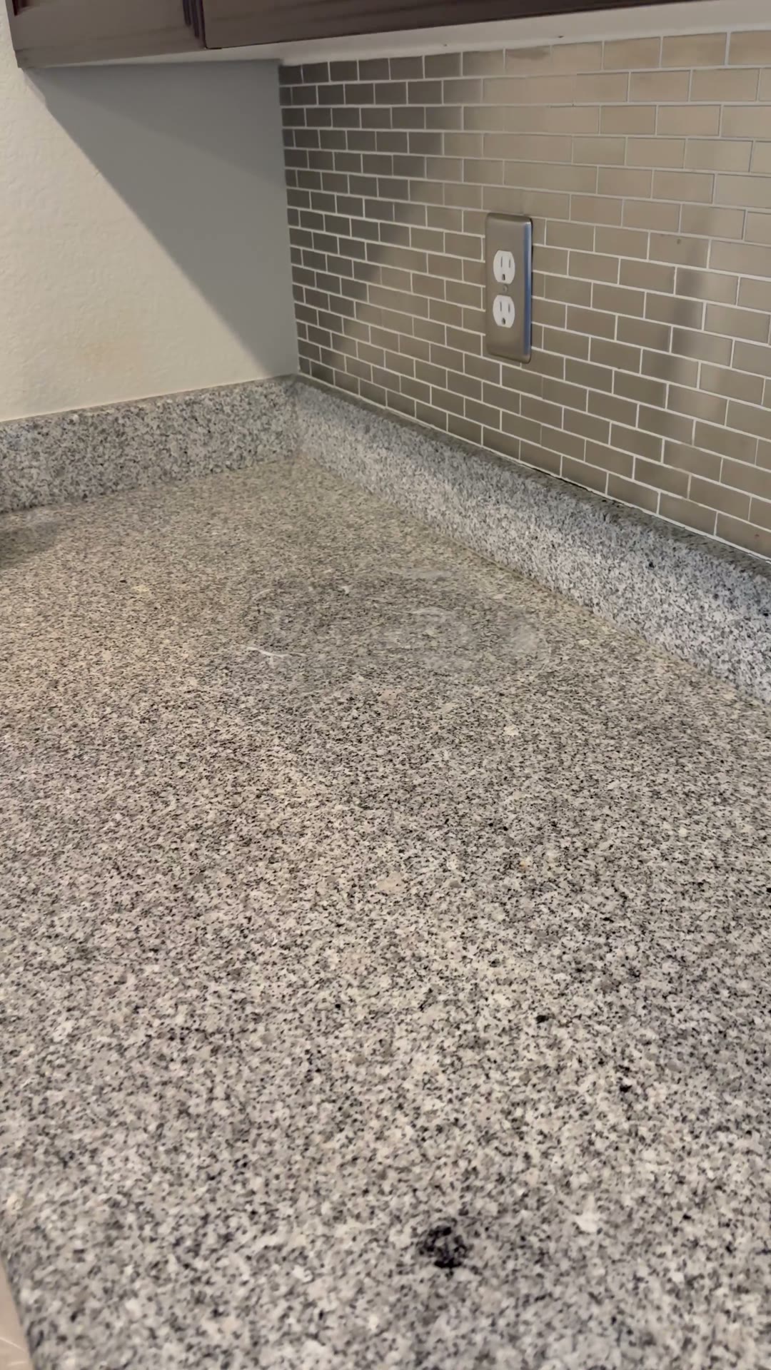 Close view of the kitchen countertop and backsplash